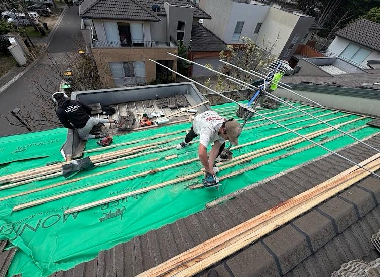 The Spartan Roofing team at work on a Brisbane home
